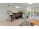 Spacious bonus room with multiple desks, sewing machines and bright natural light at 4000 Rouse Rd, Orlando, FL 32817
