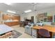 Large bonus room featuring sewing tables, multiple desks, and cabinets with craft supplies at 4000 Rouse Rd, Orlando, FL 32817
