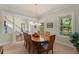 Bright dining room featuring a large table, ample windows, and neutral decor, great for entertaining guests at 4000 Rouse Rd, Orlando, FL 32817