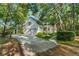 Charming home with a two-car garage nestled among mature trees and a long driveway at 4000 Rouse Rd, Orlando, FL 32817