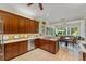 The kitchen offers expansive countertops and seamless transition into the dining space at 4000 Rouse Rd, Orlando, FL 32817