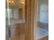 Bathroom featuring a tiled shower with glass door and a soaking tub at 4058 Brookshire Cir, Eustis, FL 32736