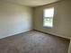 Neutral bedroom with a window allowing for ample natural light at 4058 Brookshire Cir, Eustis, FL 32736