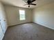 Neutral bedroom with cream walls, a ceiling fan, and a window at 4058 Brookshire Cir, Eustis, FL 32736