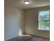 Bedroom featuring neutral carpet and a window with a view of trees and blue sky at 4058 Brookshire Cir, Eustis, FL 32736