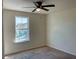Bedroom featuring a ceiling fan and a window with a street view at 4058 Brookshire Cir, Eustis, FL 32736