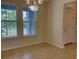 Dining room area with tile floors and two large windows providing natural light at 4058 Brookshire Cir, Eustis, FL 32736