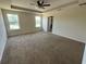 Spacious main bedroom featuring a tray ceiling and ample natural light at 4058 Brookshire Cir, Eustis, FL 32736