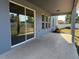 Covered patio with concrete flooring and a view of the backyard at 4058 Brookshire Cir, Eustis, FL 32736