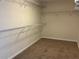 Empty walk-in closet with built-in shelving for organized storage solutions at 4058 Brookshire Cir, Eustis, FL 32736