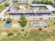 Aerial shot showcasing the apartments' recreational facilities, parking, and surrounding greenery at 43420 Highway 27 # 121, Davenport, FL 33837
