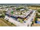 Wide aerial view of the complex featuring lush landscaping, outdoor amenities and ample parking at 43420 Highway 27 # 121, Davenport, FL 33837