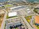Expansive aerial showing the retail development, traffic flow, and surrounding residential communities at 43420 Highway 27 # 121, Davenport, FL 33837