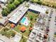 An aerial view captures the complex with a pool, cabanas and ample parking, offering a serene retreat and convenient accessibility at 43420 Highway 27 # 121, Davenport, FL 33837