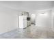 A bright, tiled living space connects seamlessly to the kitchen and bathroom, creating a functional and open layout at 43420 Highway 27 # 121, Davenport, FL 33837