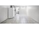 A bright, tiled living space connects seamlessly to the kitchen and bathroom, creating a functional and open layout at 43420 Highway 27 # 121, Davenport, FL 33837