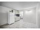 A bright, tiled living space connects seamlessly to the kitchen and bathroom, creating a functional and open layout at 43420 Highway 27 # 121, Davenport, FL 33837