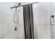 Contemporary shower with gray tiled walls and dark shower floor at 43420 Highway 27 # 121, Davenport, FL 33837