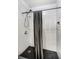 Contemporary shower with gray tiled walls and dark shower floor at 43420 Highway 27 # 121, Davenport, FL 33837