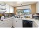 Well-lit kitchen featuring modern appliances and views from the large window at 440 Orienta Point St, Altamonte Springs, FL 32701