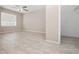 Comfortable bedroom with light wood-look floors and a bright window with neutral blinds at 4403 Hector Ct # 3, Orlando, FL 32822