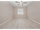 Bright bedroom featuring neutral walls, tile floors, ceiling fan, and a window at 4403 Hector Ct # 3, Orlando, FL 32822