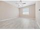 Bright bedroom featuring neutral walls, tile floors, ceiling fan, and a window at 4403 Hector Ct # 3, Orlando, FL 32822