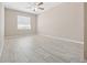 Bright bedroom featuring neutral walls, tile floors, ceiling fan, and a window at 4403 Hector Ct # 3, Orlando, FL 32822
