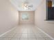 Bright living room featuring neutral walls, tile floors, ceiling fan, and a window at 4403 Hector Ct # 3, Orlando, FL 32822