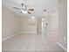Spacious living room showcasing neutral paint, tiled floor, ceiling fan, and recessed lighting at 4403 Hector Ct # 3, Orlando, FL 32822