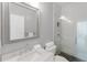 Bathroom featuring marble countertops and a walk-in shower at 478 Water St, Kissimmee, FL 34747