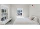 Bright bedroom with a large window and a cushioned bench at 478 Water St, Kissimmee, FL 34747