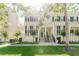 Inviting exterior of townhomes with lush landscaping and charming architectural details at 478 Water St, Kissimmee, FL 34747