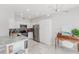 Modern kitchen with stainless steel appliances, white cabinetry, and a unique lighting fixture at 478 Water St, Kissimmee, FL 34747