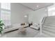 Spacious living room featuring comfortable seating, neutral tones, and natural light at 478 Water St, Kissimmee, FL 34747