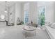 Bright, open living room with high ceilings, modern furniture, and large windows at 478 Water St, Kissimmee, FL 34747