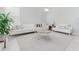 Stylish living room featuring neutral tones, modern furniture, and ample natural light at 478 Water St, Kissimmee, FL 34747