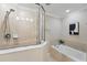 Well-lit bathroom with a glass-enclosed shower, soaking tub, neutral tile, and modern fixtures and decor at 5341 Via Appia Way, Sanford, FL 32771