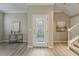 Foyer featuring wood floors, and a decorative glass front door at 5341 Via Appia Way, Sanford, FL 32771