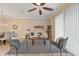 Living room features a modern ceiling fan and view to the backyard at 5341 Via Appia Way, Sanford, FL 32771