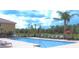 Community pool with clear water, plenty of deck chairs, and lush landscaping at 5341 Via Appia Way, Sanford, FL 32771