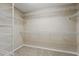 Spacious walk-in closet with multiple shelves and carpeted floor, perfect for storage at 5341 Via Appia Way, Sanford, FL 32771
