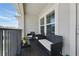 Comfortable balcony featuring outdoor furniture and a view of the surrounding neighborhood at 5838 Cypress Hill Rd, Winter Garden, FL 34787