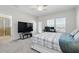 Bright bedroom with a television, workspace, walk-in shower and natural light at 5838 Cypress Hill Rd, Winter Garden, FL 34787