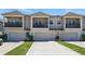 Elegant townhome showcases private balconies and attached garages in a stylish neighborhood at 5838 Cypress Hill Rd, Winter Garden, FL 34787