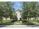 Charming two-story townhouse with meticulously landscaped front yard and mature trees at 5838 Cypress Hill Rd, Winter Garden, FL 34787