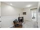 Upstairs hallway with a seating area and view into another room at 5838 Cypress Hill Rd, Winter Garden, FL 34787