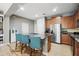Kitchen features an island with granite countertops and stainless steel appliances at 5838 Cypress Hill Rd, Winter Garden, FL 34787