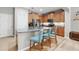Kitchen features a granite island with barstool seating and stainless steel appliances at 5838 Cypress Hill Rd, Winter Garden, FL 34787