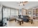 Inviting living room with natural light, cozy seating, and stylish decor at 5838 Cypress Hill Rd, Winter Garden, FL 34787